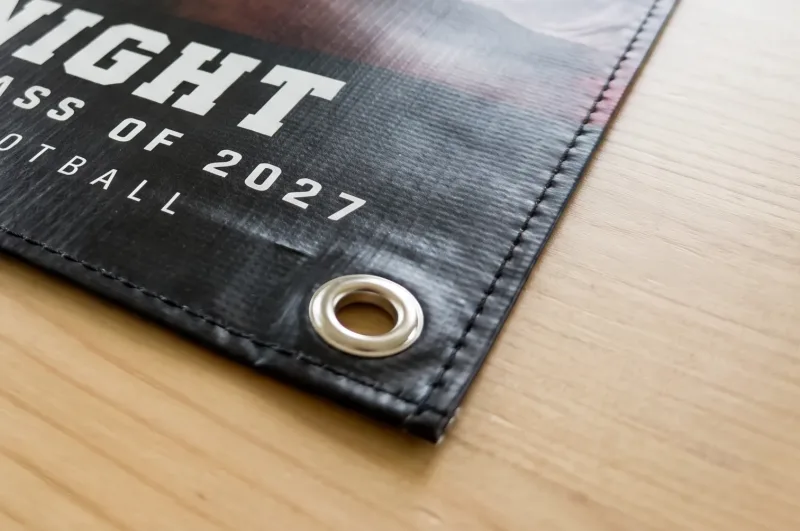Media Day Hero custom senior night banner hemmed edge and metal grommet close-up